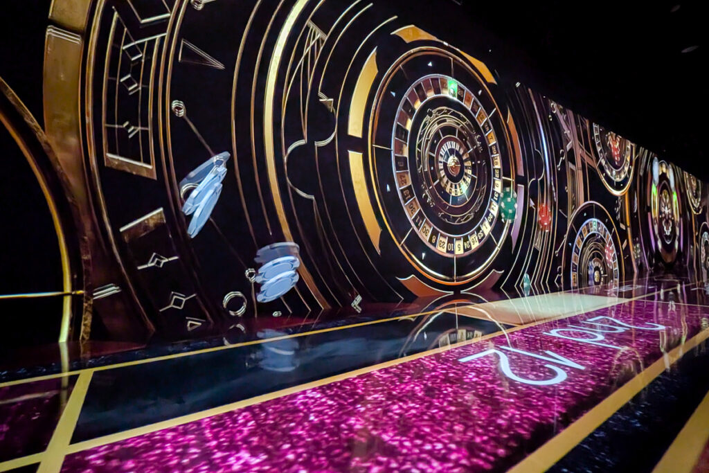 Roulette wheel and casino-themed projections in the Garden Light of Las Vegas display at Arte Museum Las Vegas.