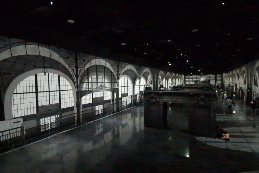 Projection of the Musée d’Orsay train station interior across the walls of the Garden room at Arte Museum Las Vegas.