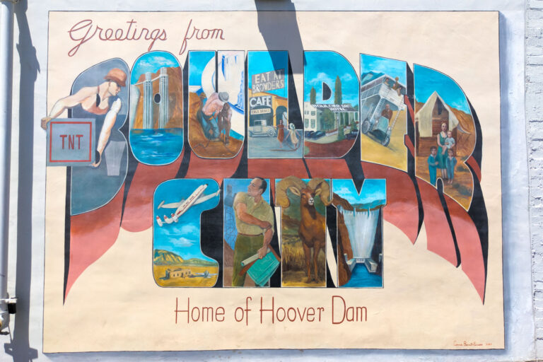 "Greetings from Boulder City, Home of Hoover Dam" postcard-style mural in downtown Boulder City, depicting scenes from the dam's construction and a bighorn sheep.